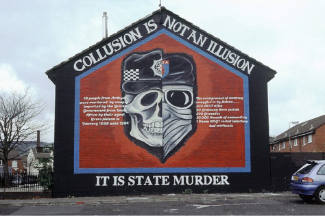 It says, “10 people from Ardoyne were murdered by weapon imported by the British Government from South Africa by their agent Brian Nelson in January 1988 until 1994. The consignment of weapons smuggled in by Nelson.... 200 AK47 rifles, 90 Browning 9mm pistols, 500 Grenades, 30,000 Rounds of ammunition, 1 Dozen RPG7 rocket launchers and warheads. Collusion is Not an Illusion, It is State Murder.”